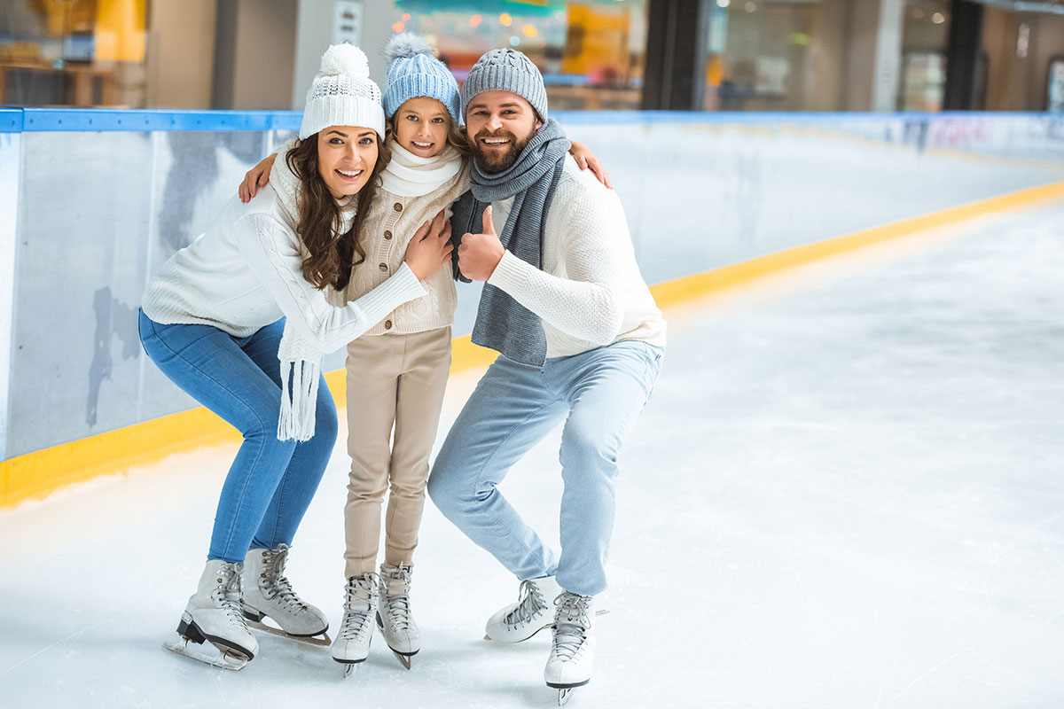 Parents & Young Girl Together On Ice