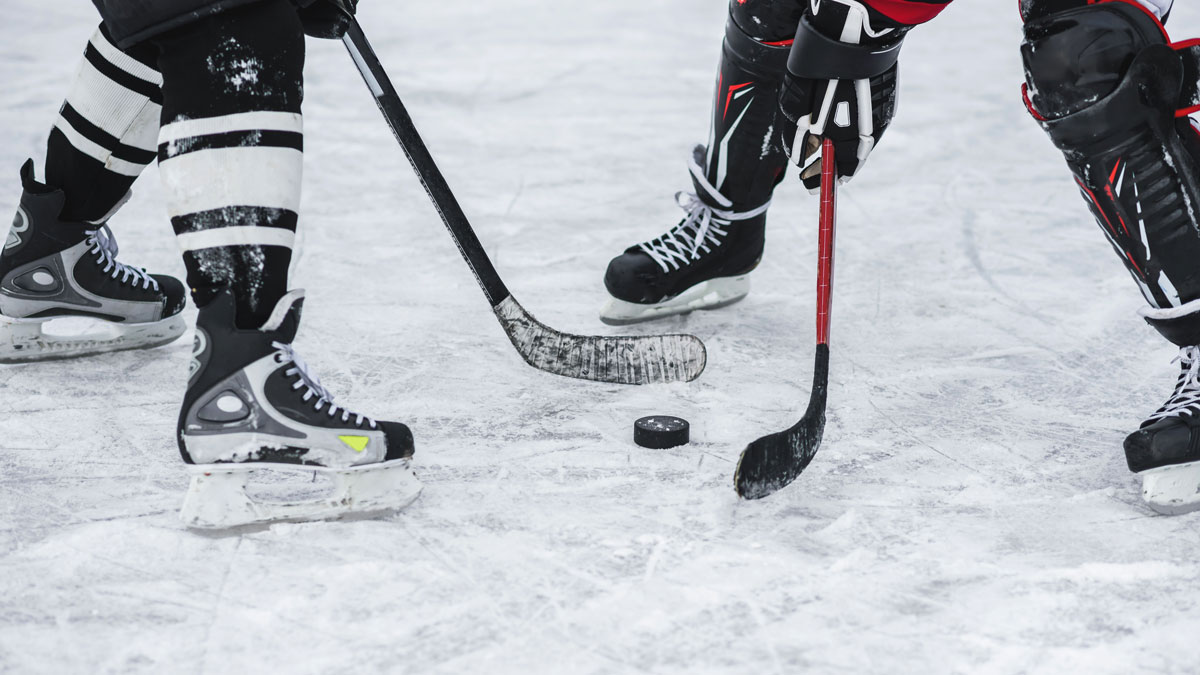 Two Hockey Players - About To Faceoff - Close Up On Puck