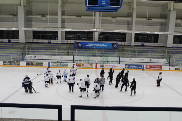 Wide Shot of Two Hockey Teams On Ice